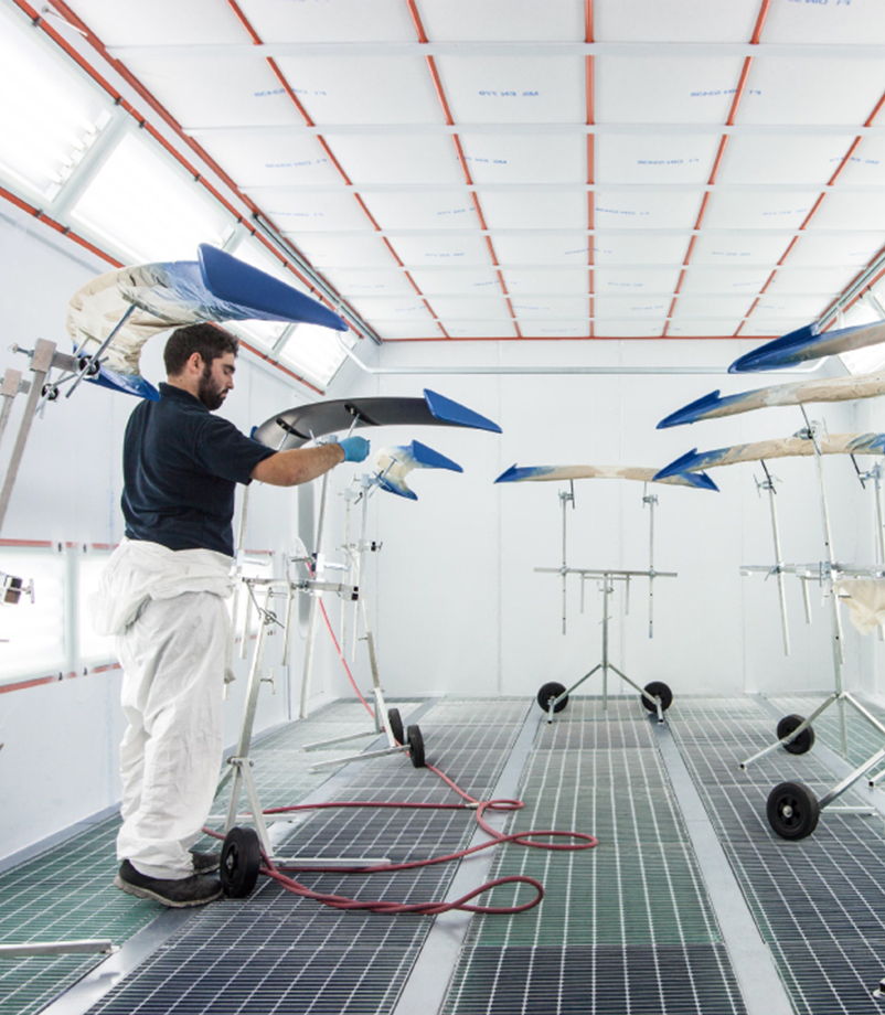 aviation maintenance technician working in an aircraft hangar