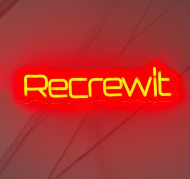 Recrewit neon logo for international Automotive Aviation Marine hiring specialists